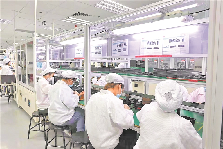 位于光明区的欣旺达电子股份有限公司生产车间马力全开.