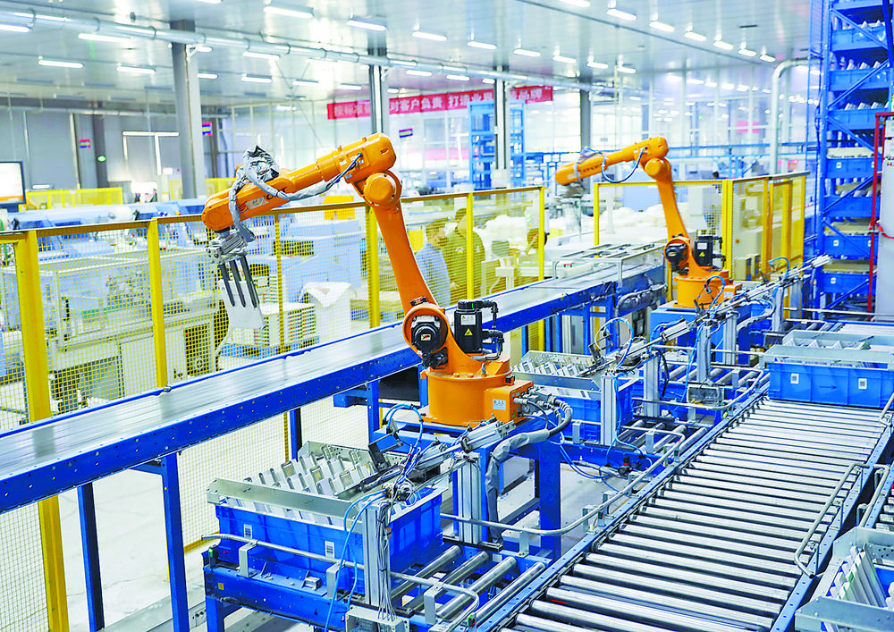 高新区工业园北京虎彩图书装订有限公司生产车间的书芯自动化生产线