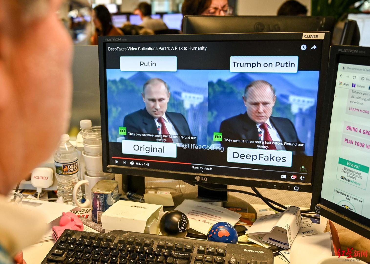 ↑美国华盛顿，一名记者在自己的办公桌上观看一段利用人工智能操纵的“深度伪造”视频 据视觉中国