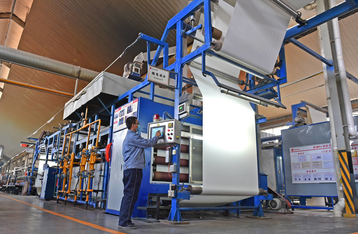 三台县佳联(佳禧)印染公司生产车间一角.三台县委宣传部供图