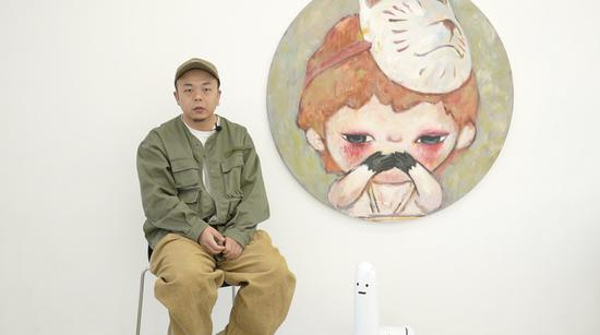 泡泡玛特设计总监宣毅郎接受国是直通车专访 国是直通车 金易子 摄