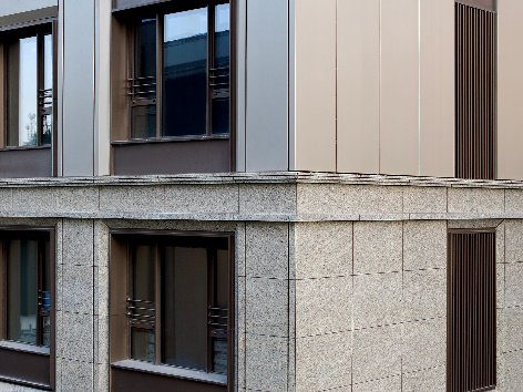 (一,二层石材立面实景图及结构示意图)