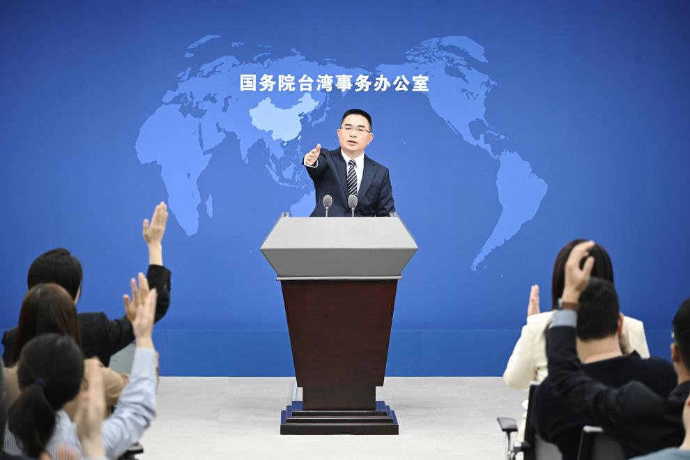 3月13日,国台办发言人陈斌华邀请记者提问.新华社记者 陈晔华 摄