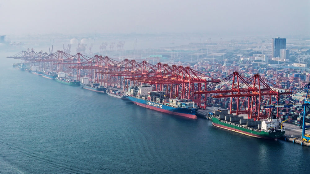 在广西钦州港码头,多艘海轮在排队卸货(无人机照片,2024年3月28日摄).
