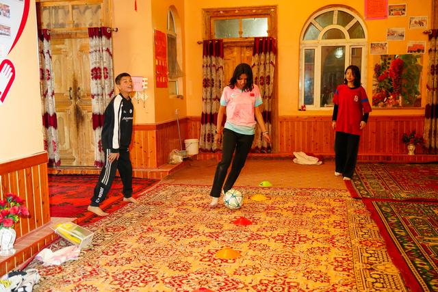 Young girl competing in ball dribbling skills