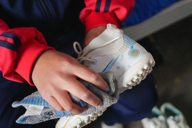 Team player wiping his sneakers