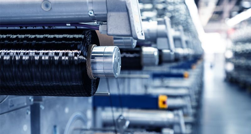 图为中复神鹰碳纤维生产线。图源：公司官网