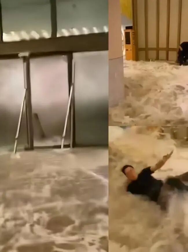 海水沖入酒店內并沖倒工作人員 （人民日報視頻截圖）