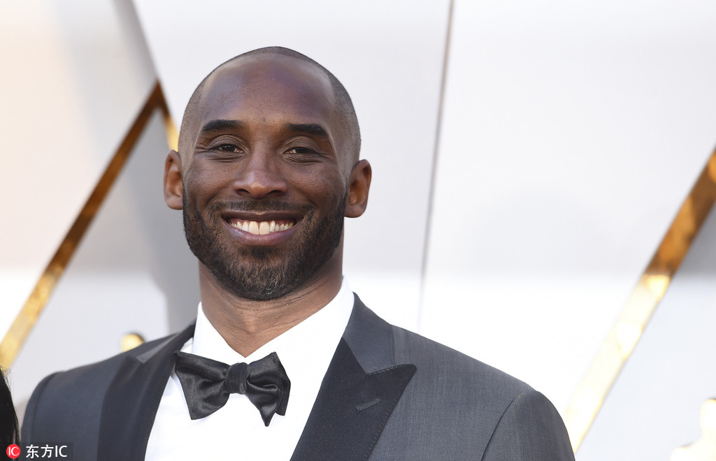 科比携妻亮相奥斯卡颁奖礼