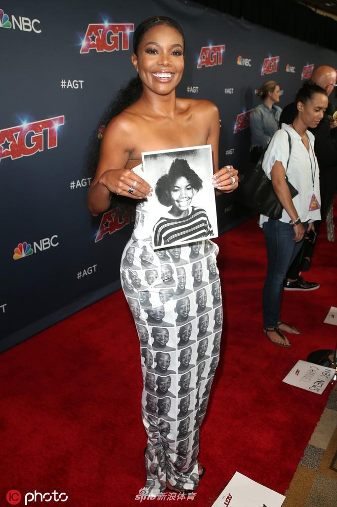 韦德爱妻尤尼恩只身现达人秀红毯