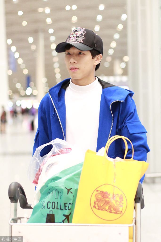 王皓率樊振东林高远回国抵京