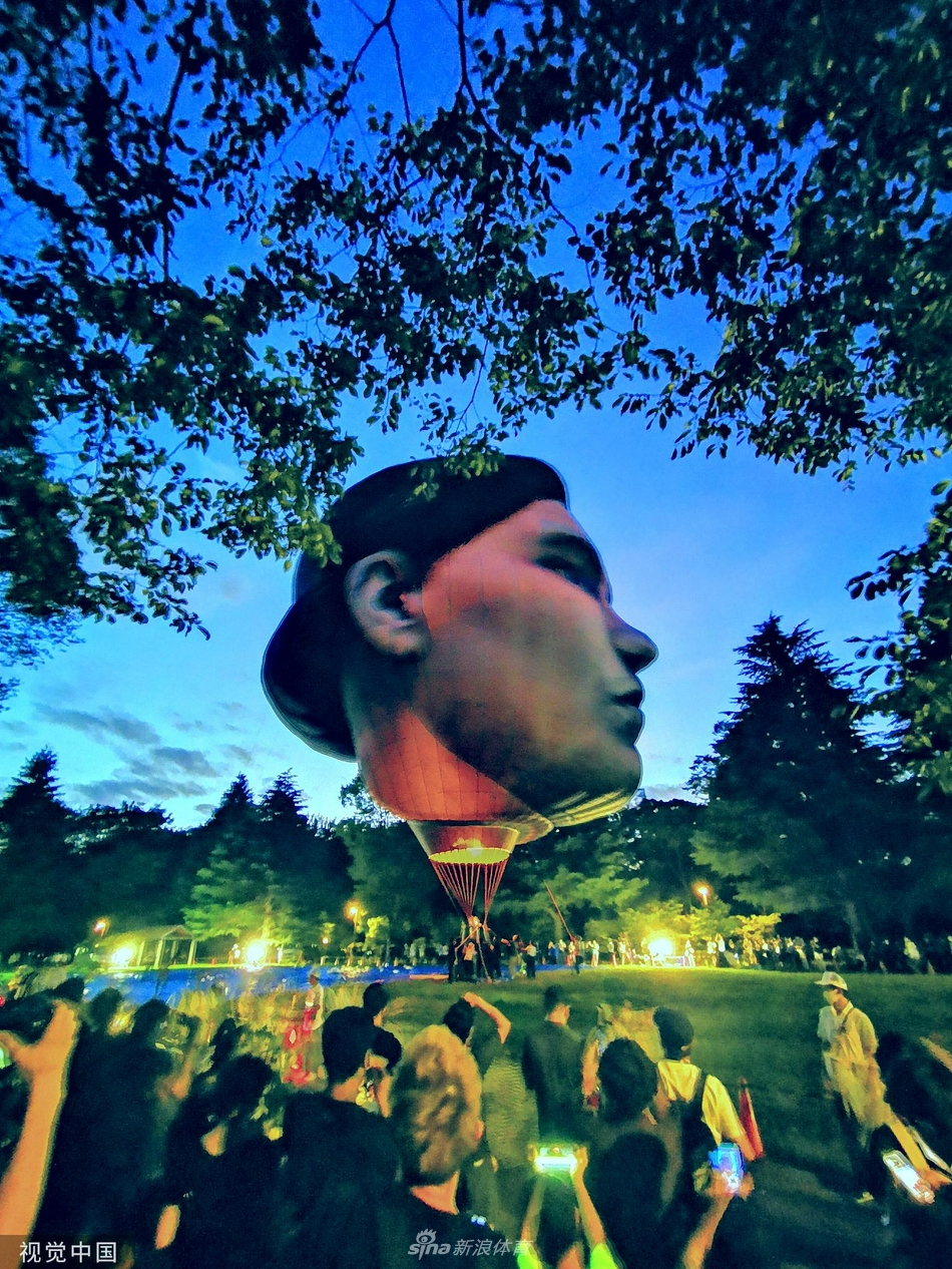 迎奥运 东京公园内出现“巨大人脸”