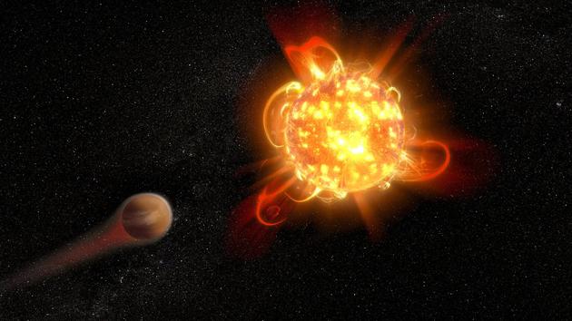 艺术家描绘一颗燃烧红矮星剥离了轨道运行行星的大气层