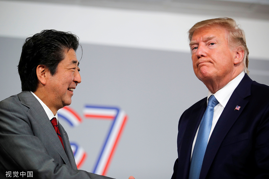 安倍和特朗普在G7会议中举走座谈,图自视觉中国