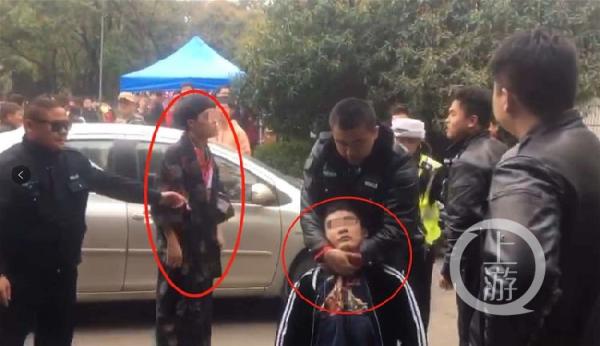 　被指穿“和服”的青年人与武汉大学保卫人员发生冲突。 上游新闻 图