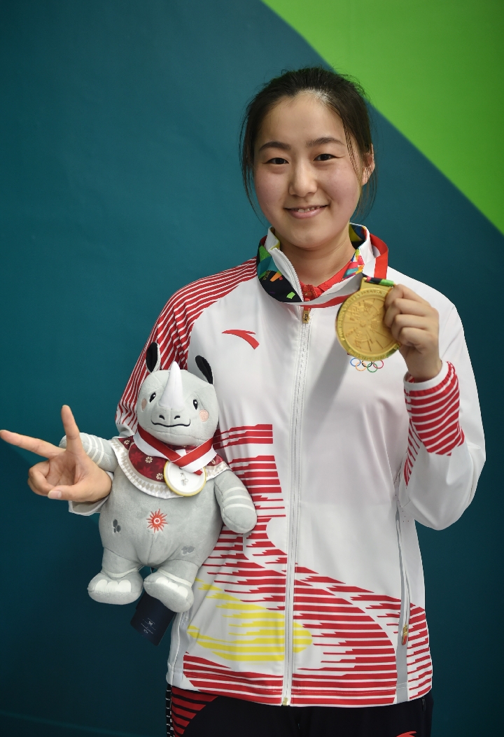 当日,在第18届亚运会女子10米气手枪决赛中,中国选手王倩以240.
