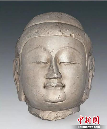 山西忻州忻府佛教造像窖藏坑出土佛像。　考古所提供