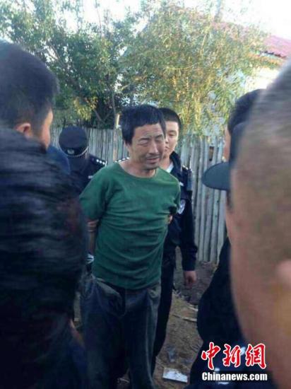 黑龙江杀警越狱案二审维持原判 2人死刑1人无期 资料图:高玉伦被抓现场。钟欣 摄