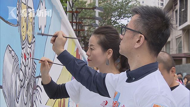 221人绘就65米彩绘墙共筑中国梦献礼十九大