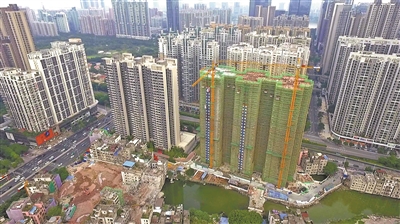 冼村改造再迎喜事 二期回迁房顺利封顶