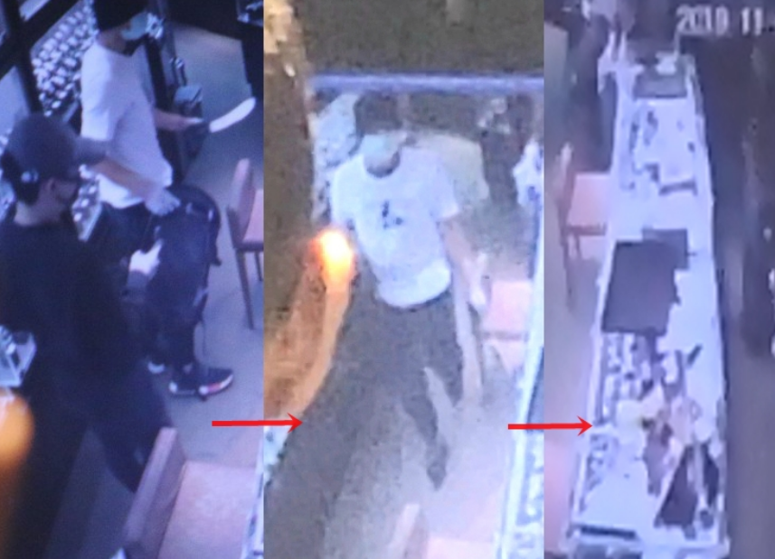  监控录像拍下抢劫犯打劫表行时的画面（图片来源：香港《星岛日报》）