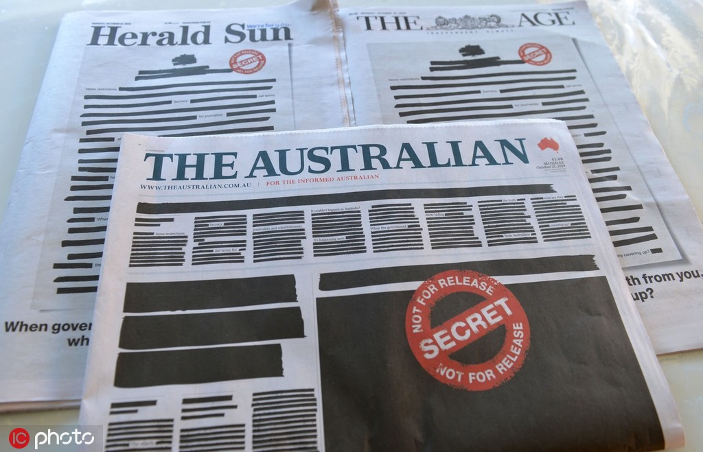 《先驱太阳报》（左）、《澳大利亚人报》（中）、《世纪报》（右）21日头版 @IC Photo